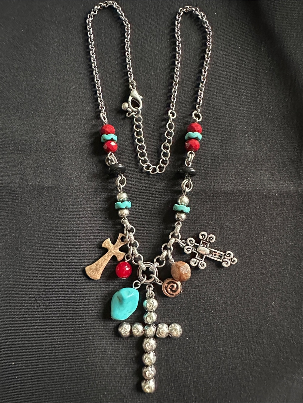 Multi-cross necklace EUC in silvertone. 3 crosses plus charms & faux stones